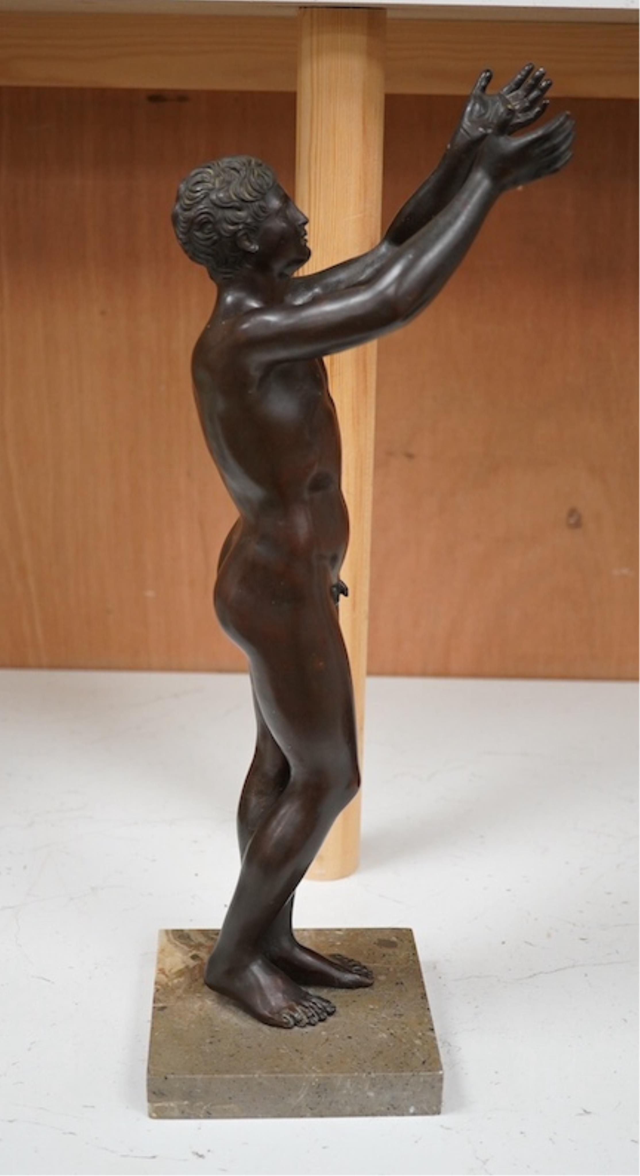 A patinated bronze figure, after the antique ‘The Praying Boy’. 42cm high. Condition - good